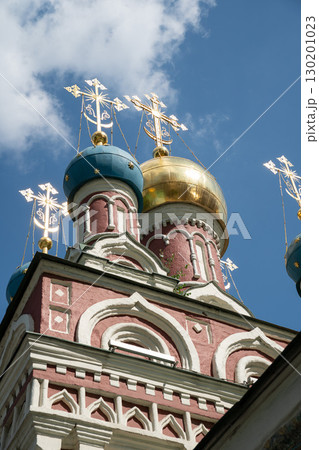 Ornate domes of the Assumption Church (Uspenskaya) in Taganka district, Moscow, with gleaming golden and blue cupolas crowned by Orthodox crosses 130201023