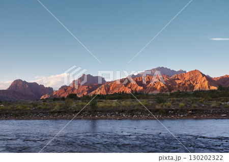 river and rocky mountains at sunset in Tianshan Mysterious Grand Canyon, Xinjiang, China 130202322