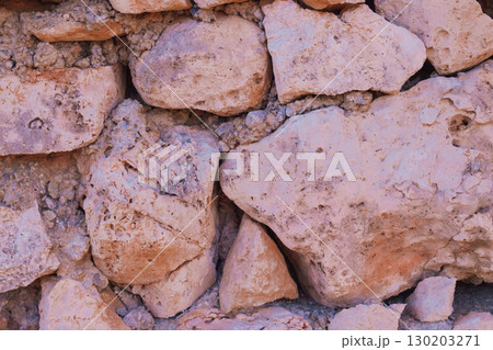Old natural stone masonry without mortar between the stones, natural background 130203271