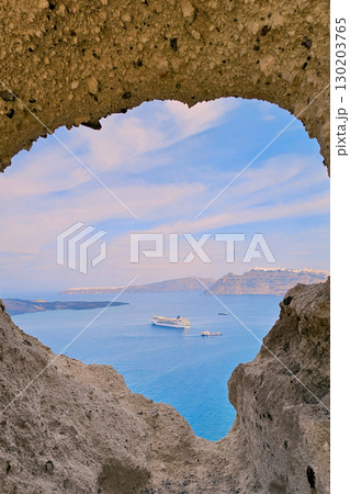 Heart of Santorini. Cruise ship in the sea near Megalochori, Greece 130203765