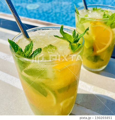Refreshing Orange Mojito by the Pool Refreshing Orange Mojito by the Pool 130203851