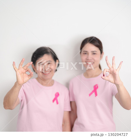 Couple woman with pink Ribbon for Pink October Breast Cancer Awareness month, May Women Health, November Birth Parents Adoption, women rights, Empowerment, March International Women day and Cancer day 130204727