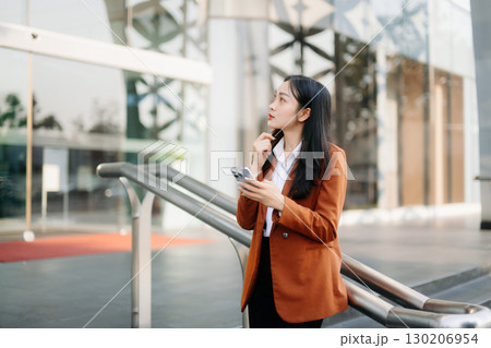 oung Asian business woman leader entrepreneur, professional manager holding digital tablet computer oung Asian business woman leader entrepreneur, professional manager holding digital tablet computer 130206954