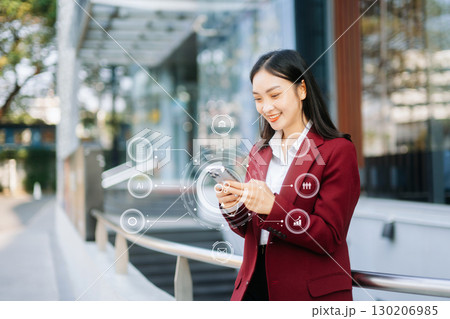 Digital marketing media in virtual screen.businesswoman hand working with mobile phone and modern compute Digital marketing media in virtual screen.businesswoman hand working with mobile phone and modern compute 130206985