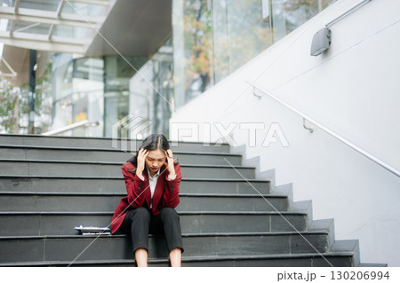 Young Asian business woman leader entrepreneur, professional manager holding digital tablet computer in big city Young Asian business woman leader entrepreneur, professional manager holding digital tablet computer in big city 130206994