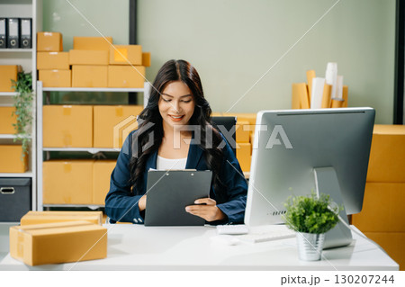 Startup small business SME, Entrepreneur owner woman using smartphone or tablet taking receive and checking 130207244