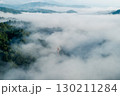 Morning mist in the forest and mountains 130211284