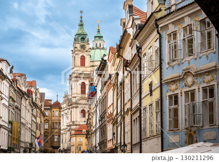 Prague, Czech Republic, August 6, 2023. Breathtaking view, on a beautiful summer day, from Charles Bridge towards the Lesser Town district. The colorful facades stand out. Iconic views of the city. Prague, Czech Republic, August 6, 2023. Breathtaking view, on a beautiful summer day, from Charles Bridge towards the Lesser Town district. The colorful facades stand out. Iconic views of the city. 130211296