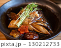 Salmon Kabutoni, a Japanese dish featuring salmon head simmered in a savory, sweet soy sauce. 130212733