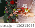Beautiful Redhead Woman Holding Plate with Cakes 130213045