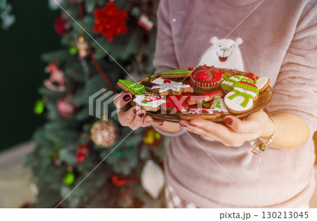 Beautiful Redhead Woman Holding Plate with Cakes Beautiful Redhead Woman Holding Plate with Cakes 130213045