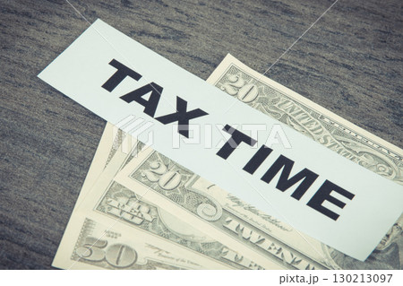 Inscription tax time and dollar banknotes. Calculating and paying tax for previous year Inscription tax time and dollar banknotes. Calculating and paying tax for previous year 130213097