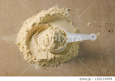 protein powder in scoop. dry mixture for preparation of sporting or dietary drink. 130214809