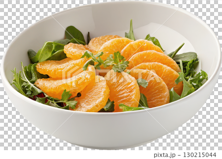 A vibrant and fresh orange and green leafy salad served in a clean white bowl 130215044