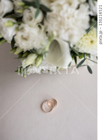 Romantic wedding rings and bouquet 130216521