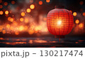Red paper lantern glowing against bokeh background, festive Asian atmosphere 130217474