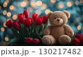 Red tulips with plush teddy bear against bokeh lights, romantic gift concept 130217482