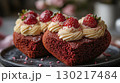 Red velvet cupcakes decorated with cream and strawberries, gourmet dessert concept 130217484