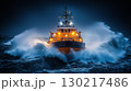 Rescue vessel navigating through stormy waves at night, illuminated emergency ship with powerful searchlights in rough sea 130217486