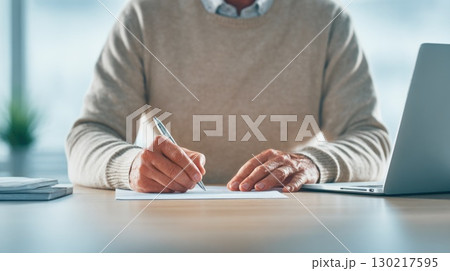 Businessman Signing Documents Businessman Signing Documents 130217595