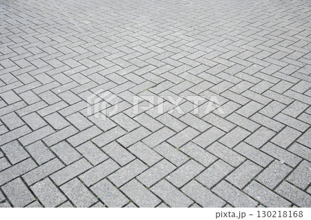 Gray structural stone wall of the ancient building consists of bricks. Nature structural background. Gray structural stone wall of the ancient building consists of bricks. Nature structural background. 130218168