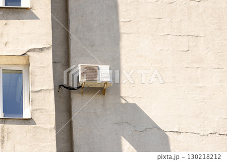 air conditioner is mounted on wall. technologies for air cooling in hot weather. air temperature 130218212