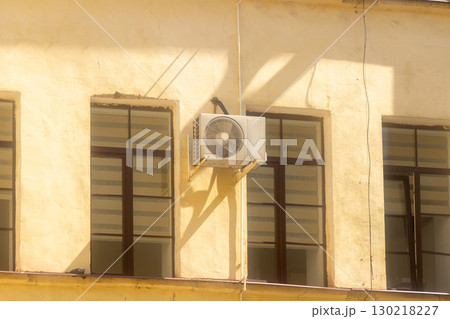 air conditioner is mounted on wall. technologies for air cooling in hot weather. air temperature 130218227