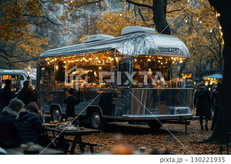 Food truck festival urban park outdoor event autumn atmosphere cozy gathering culinary experience 130221935
