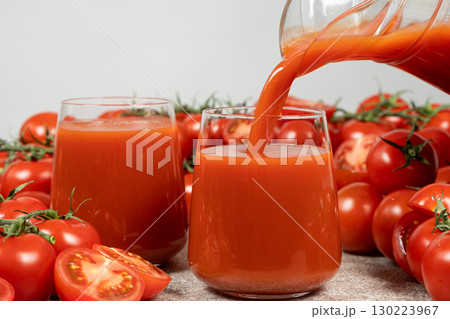 Freshly squeezed organic tomato juice poured into a glass. Freshly squeezed organic tomato juice poured into a glass. 130223967