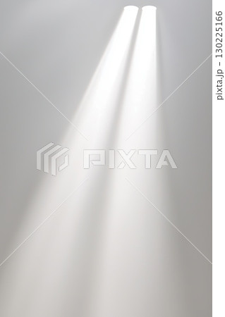 White wall receiving soft light beams, creating gentle gradient and minimalist ambiance. Serene illumination highlighting clean, elegant architectural design 130225166