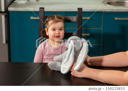 Warm interaction between woman and small child during learning play at home. Concept of early development, preschool skills, and nurturing relationships 130225653