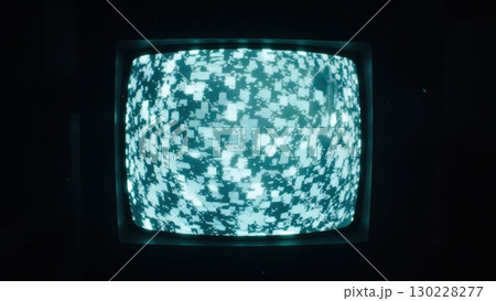Old analog television showing abstract pixelated noise pattern 130228277