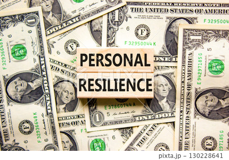 Personal resilience symbol. Concept word Personal resilience on wooden blocks. Beautiful background from dollar bills. Business psychological personal resilience concept. Copy space. 130228641