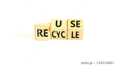 Reuse or recycle symbol. Concept words Reuse Recycle on wooden block. Beautiful white table white background. Business reuse or recycle concept. Copy space. 130228661