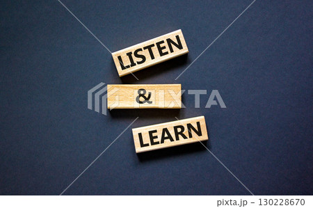 Listen and learn symbol. Concept words Listen and learn on wooden blocks. Beautiful black table black background. Copy space. Business, educational and listen and learn concept. Listen and learn symbol. Concept words Listen and learn on wooden blocks. Beautiful black table black background. Copy space. Business, educational and listen and learn concept. 130228670
