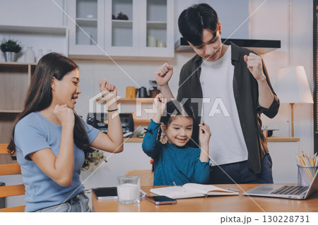 Family spends their free time together Family spends their free time together 130228731