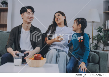 Family spends their free time together Family spends their free time together 130228750