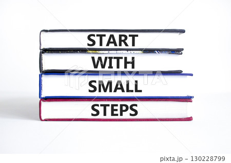 Start with small steps symbol. Concept words phrase Start with small steps on beautiful books. Beautiful white paper background. Business Start with small steps concept. Copy space. Start with small steps symbol. Concept words phrase Start with small steps on beautiful books. Beautiful white paper background. Business Start with small steps concept. Copy space. 130228799