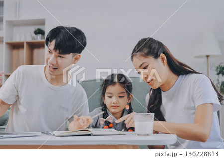 Family spends their free time together Family spends their free time together 130228813