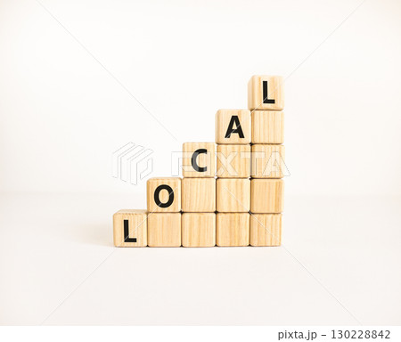 Local symbol. Concept word Local on beautiful wooden blocks. Beautiful white table white background. Business lifestyle local concept. Copy space. 130228842