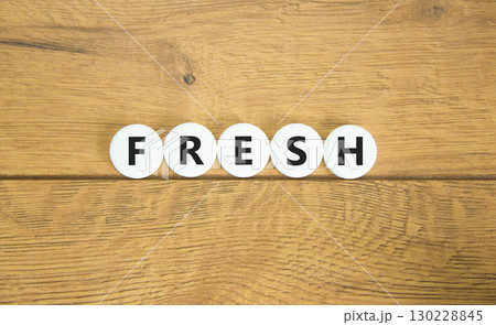 Fresh symbol. Concept word Fresh on beautiful white pills circles. Beautiful wooden table wooden background. Business lifestyle fresh concept. Copy space. Fresh symbol. Concept word Fresh on beautiful white pills circles. Beautiful wooden table wooden background. Business lifestyle fresh concept. Copy space. 130228845