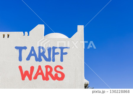 Trade tariff wars symbol. Concept word Tariff wars on beautiful white wall. Beautiful blue sky background. Business trade tariff wars concept. Copy space. 130228868