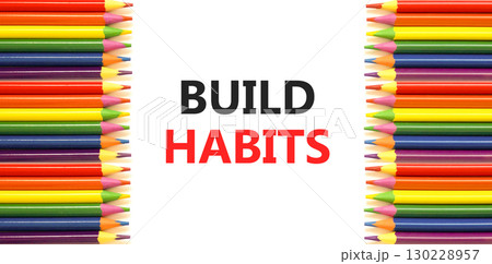 Build habits symbol. Concept word Build habits on beautiful white paper. Colored pencils. Beautiful white paper background. Business build habits concept. Copy space. 130228957