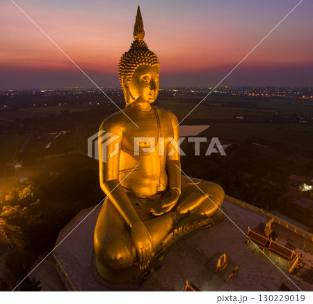 aerial view scenery sky in sunset behind the largest Buddha statue in the world. 130229019