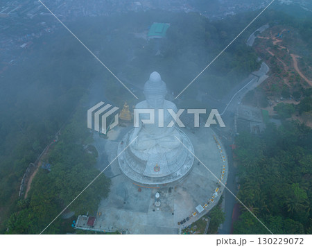 aerial view Mist blows over the Phuket Big Buddha in sweet sunrise aerial view Mist blows over the Phuket Big Buddha in sweet sunrise 130229072