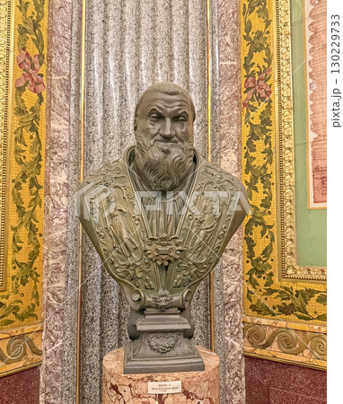 VATICAN CITY, ROME, ITALY - AUGUST 02, 2025 Sisto V bust copy by Bastiano Torrigiani. Pope wears an ecclesiastical robe with intricate reliefs of figures and symbols 130229733