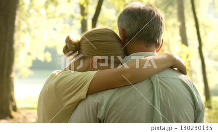 Loving Father Embracing Grown Daughter in Peaceful Natural Setting 130230135