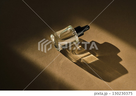 Natural facial serum with beautiful highlights on a beige background. 130230375