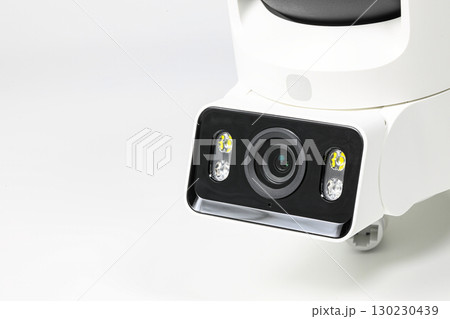 close-up shot lens of home security camera on white background. 130230439