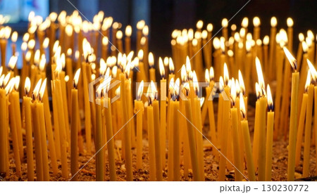 Ritual candles illuminate sacred space during a spiritual gathering in a tranquil setting 130230772
